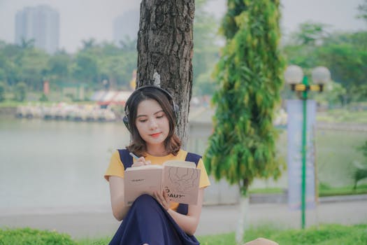 student meditating in a park